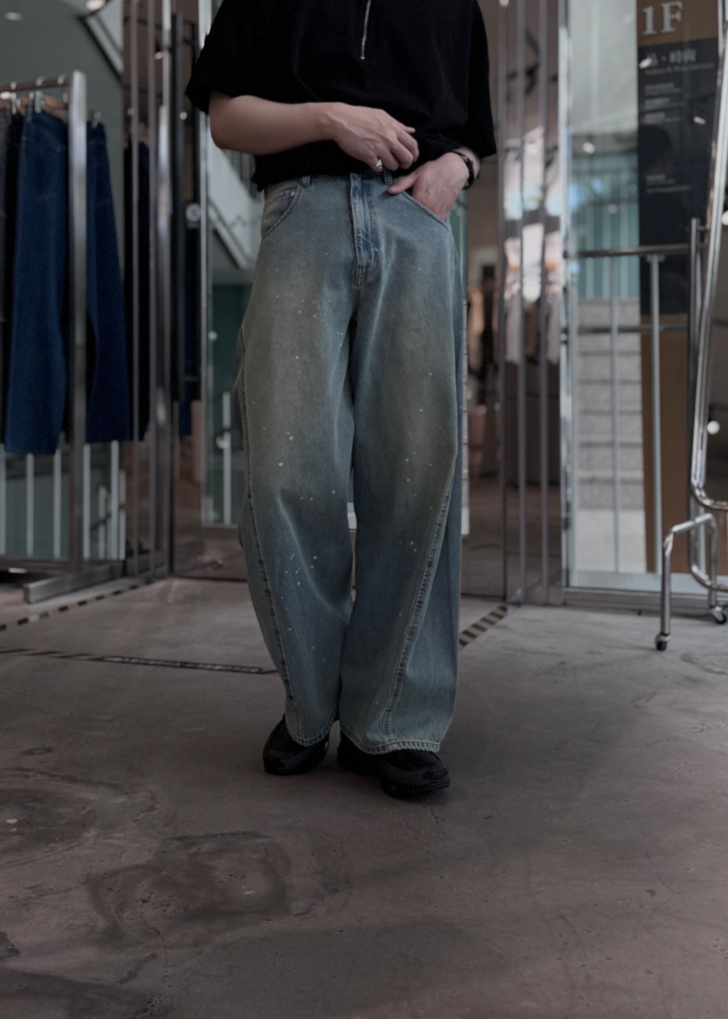aging twisted denim pants