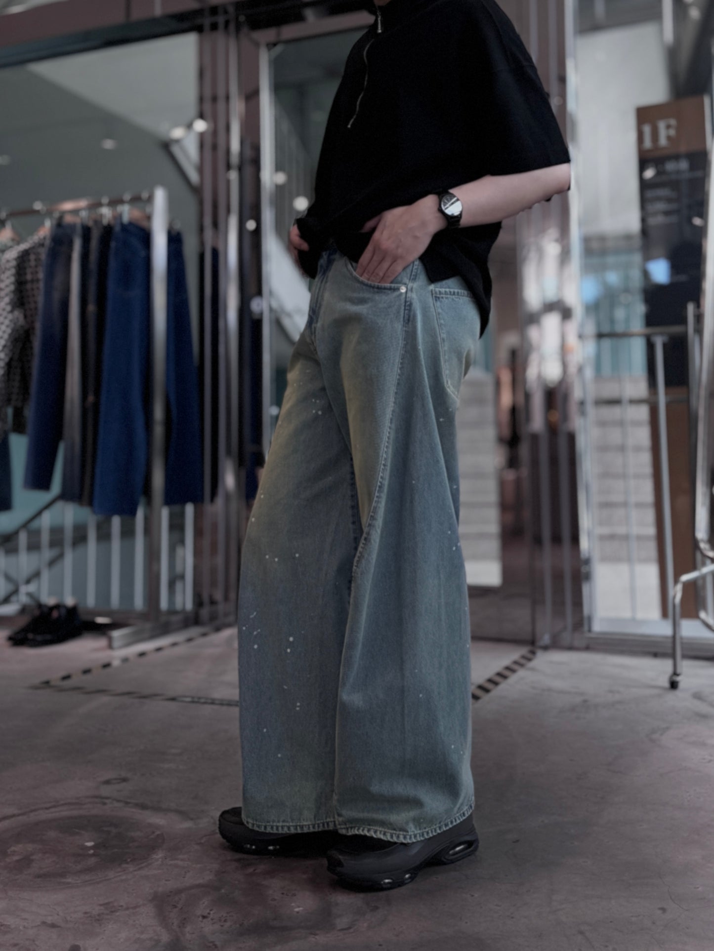 aging twisted denim pants