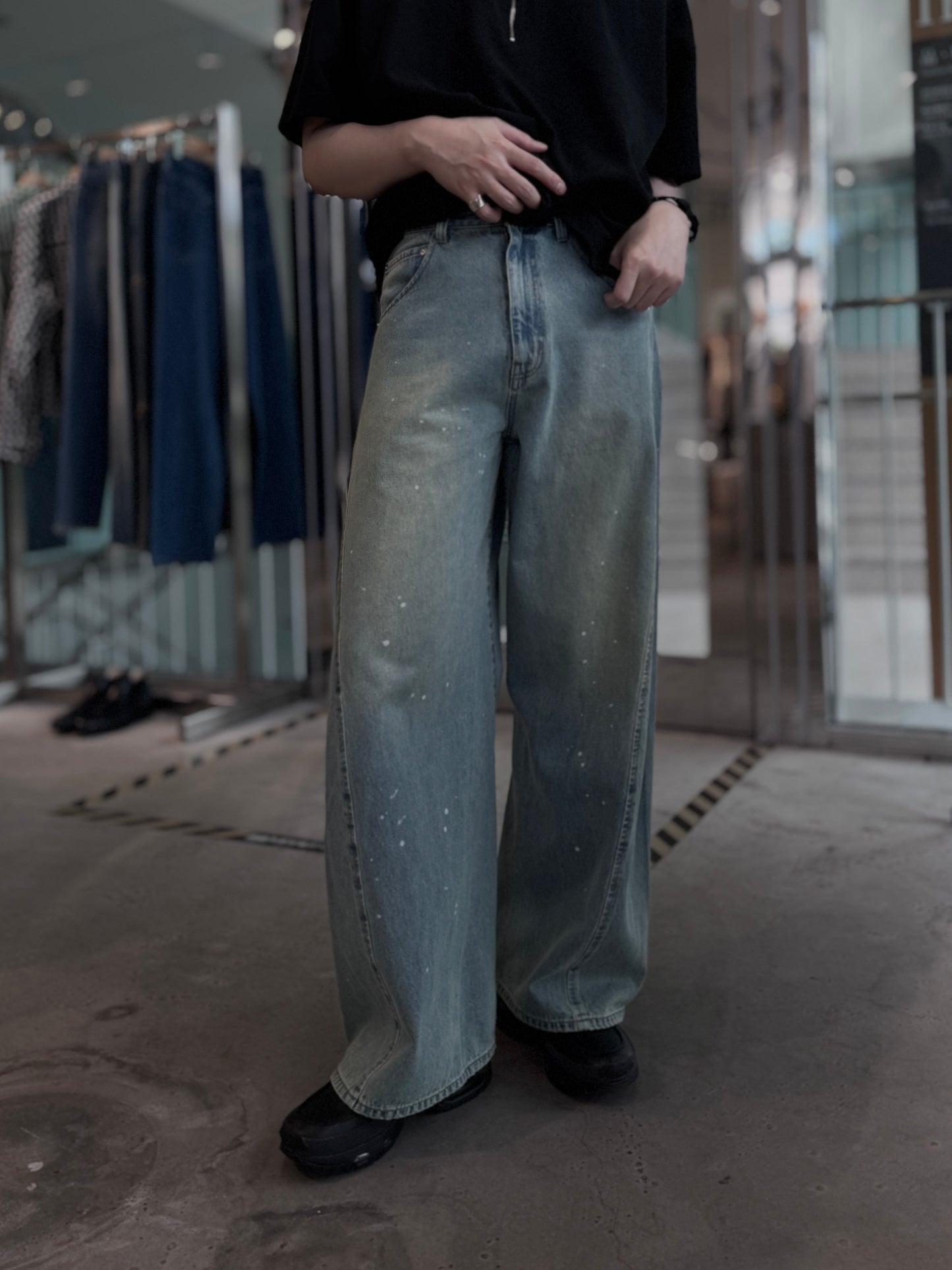 aging twisted denim pants