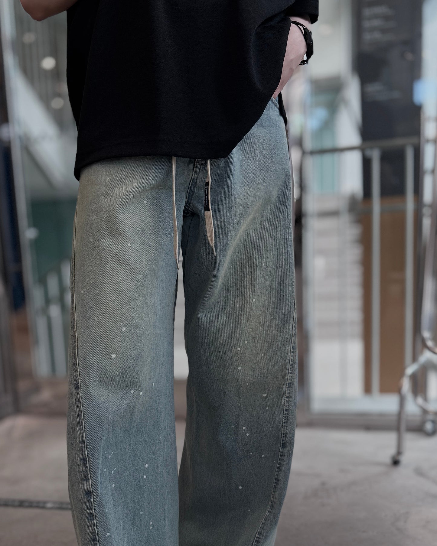 aging twisted denim pants