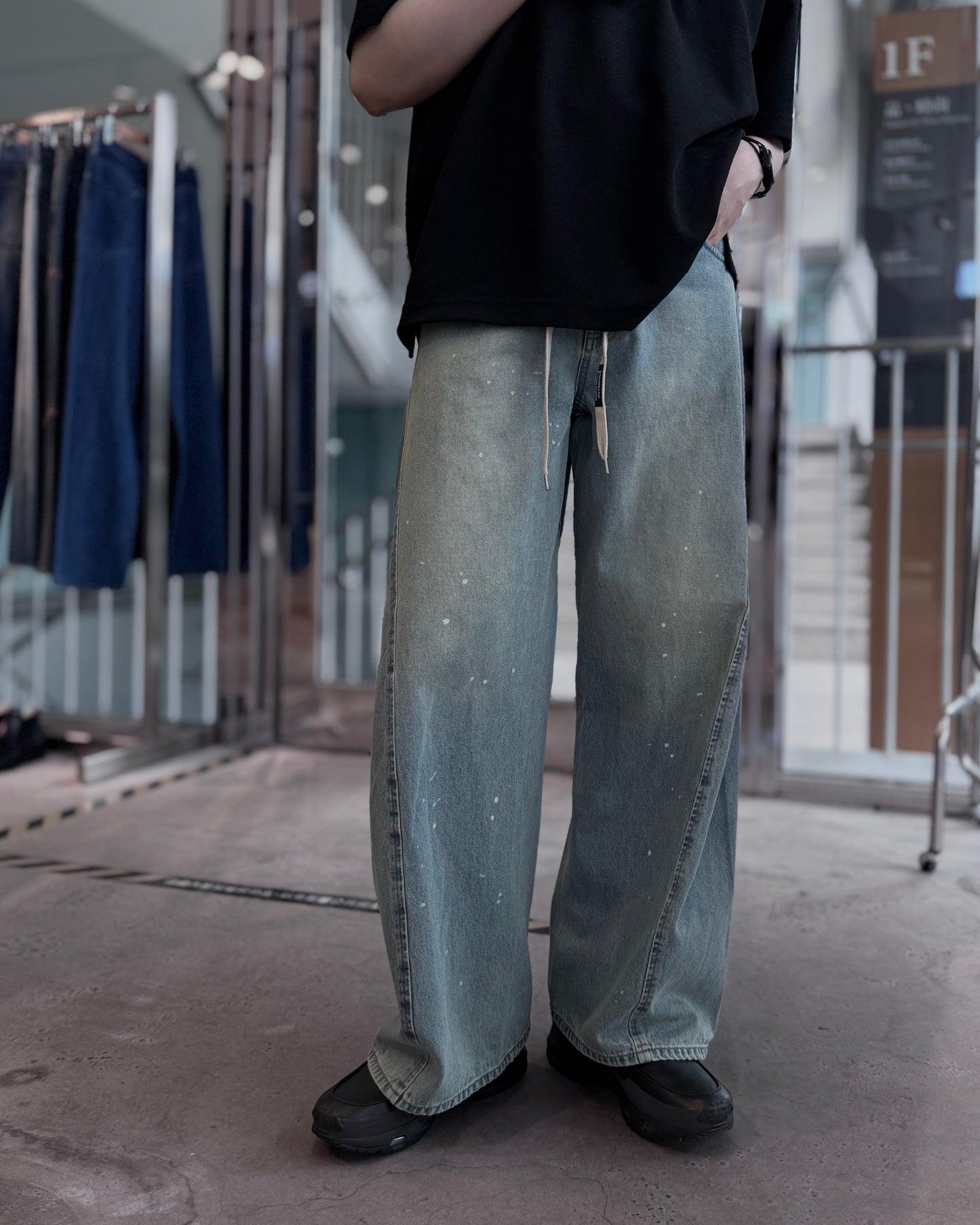 aging twisted denim pants