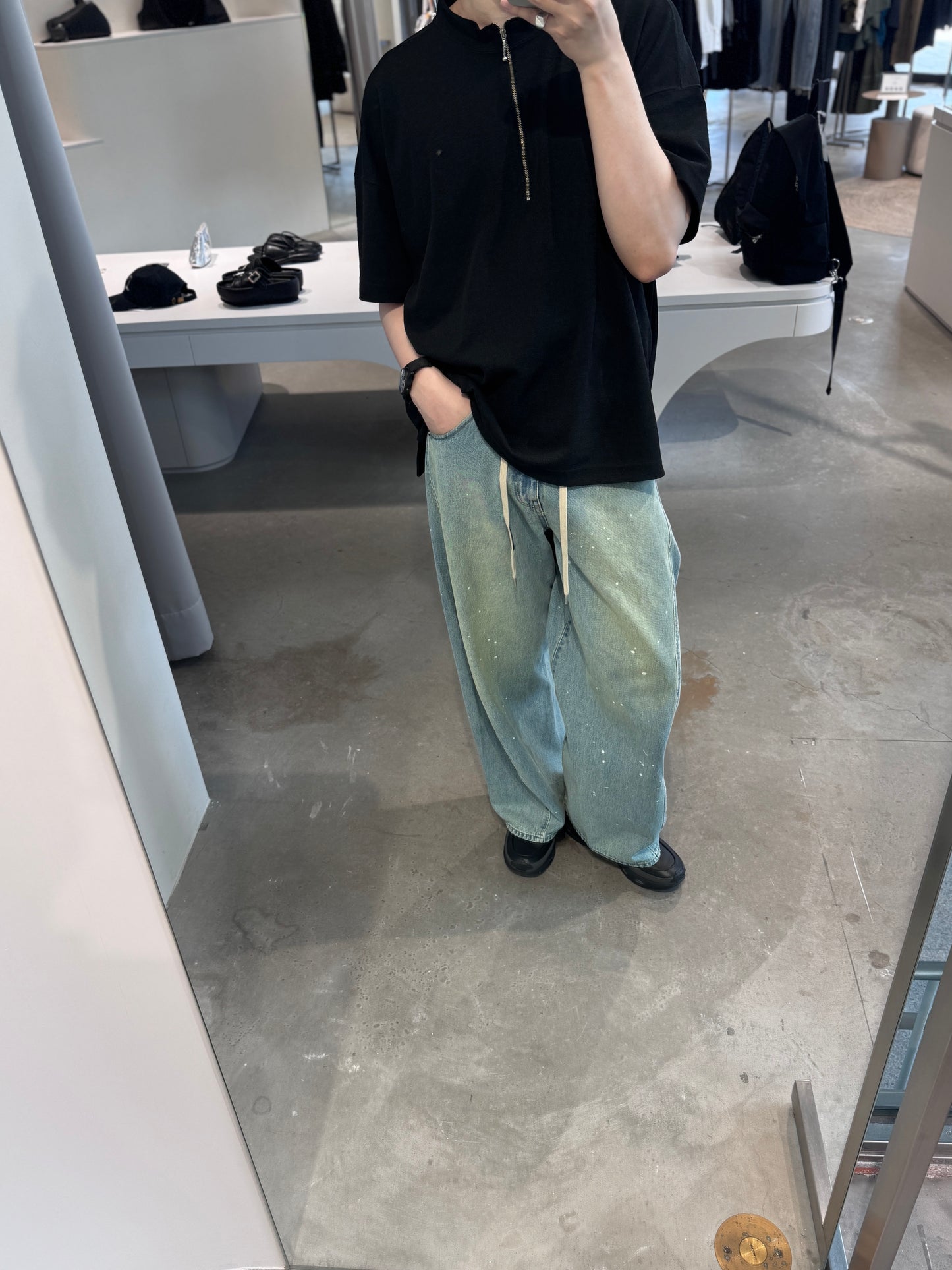 aging twisted denim pants