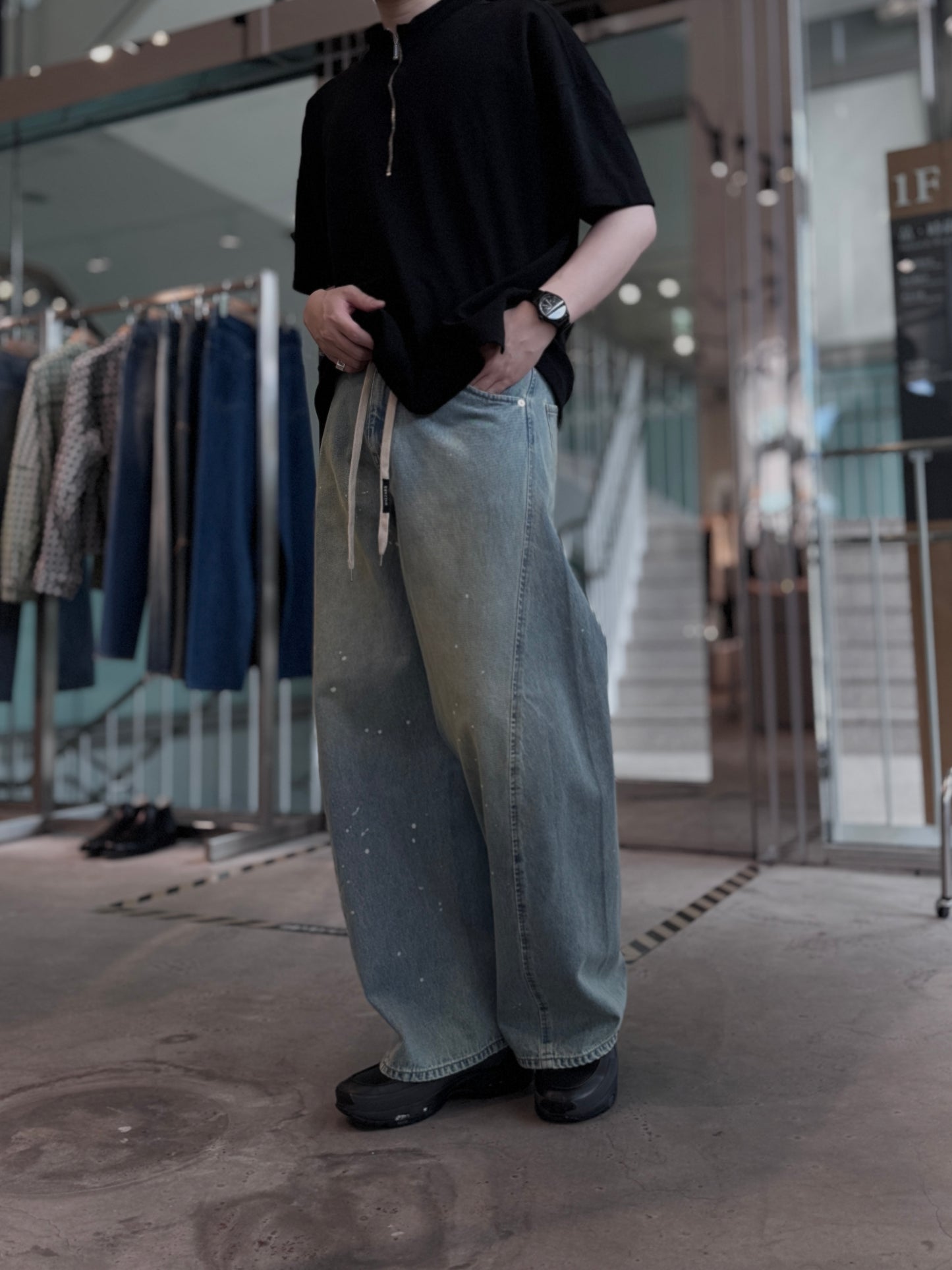 aging twisted denim pants