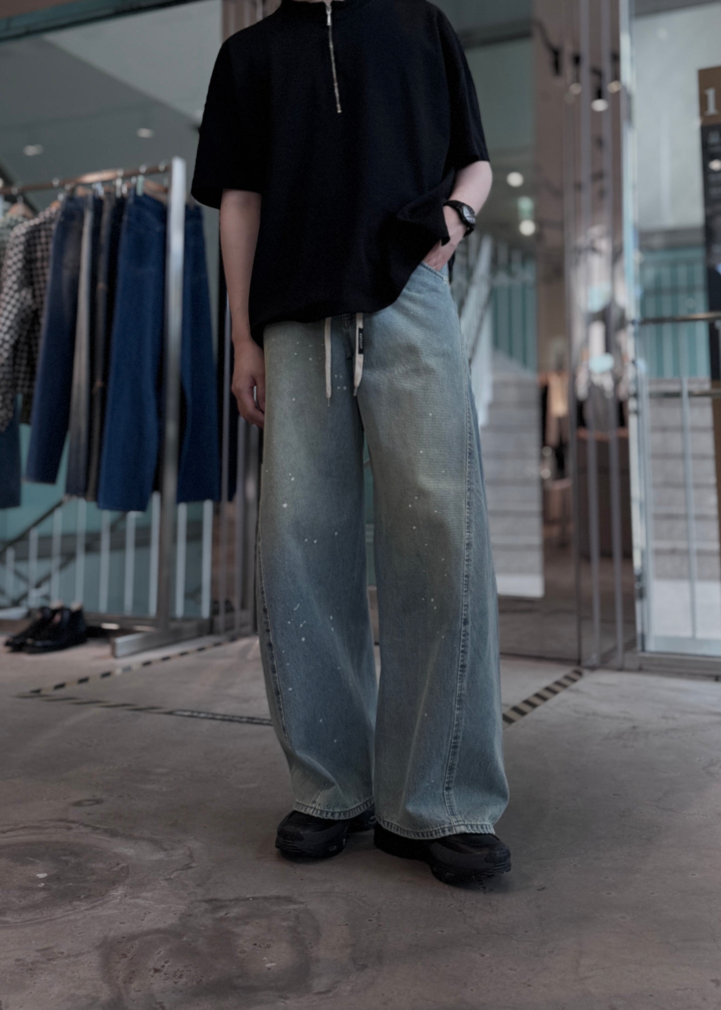 aging twisted denim pants