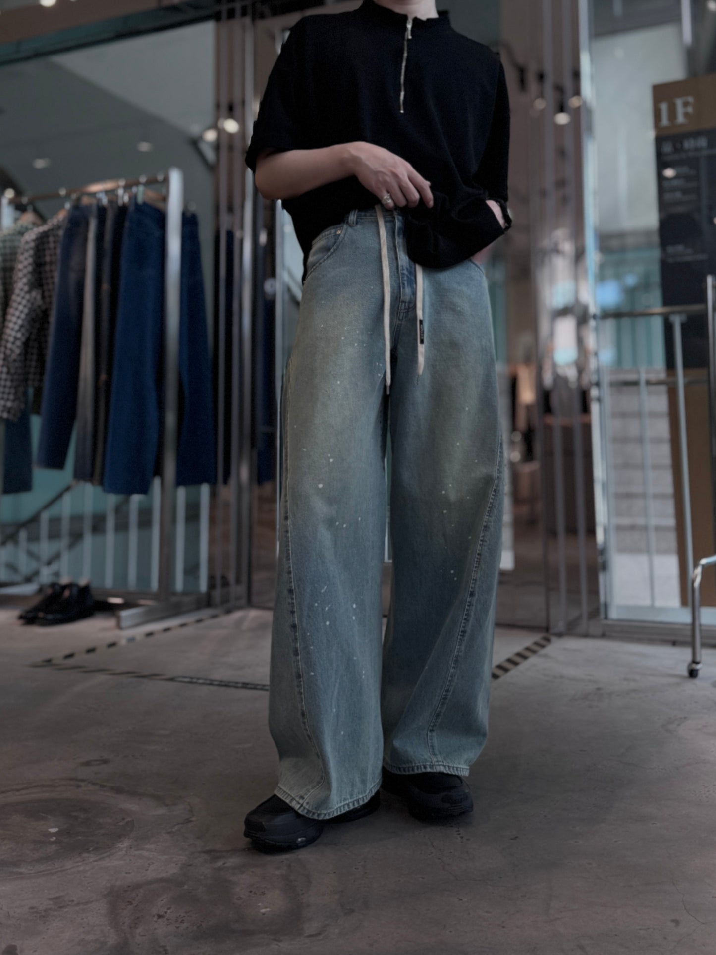 aging twisted denim pants