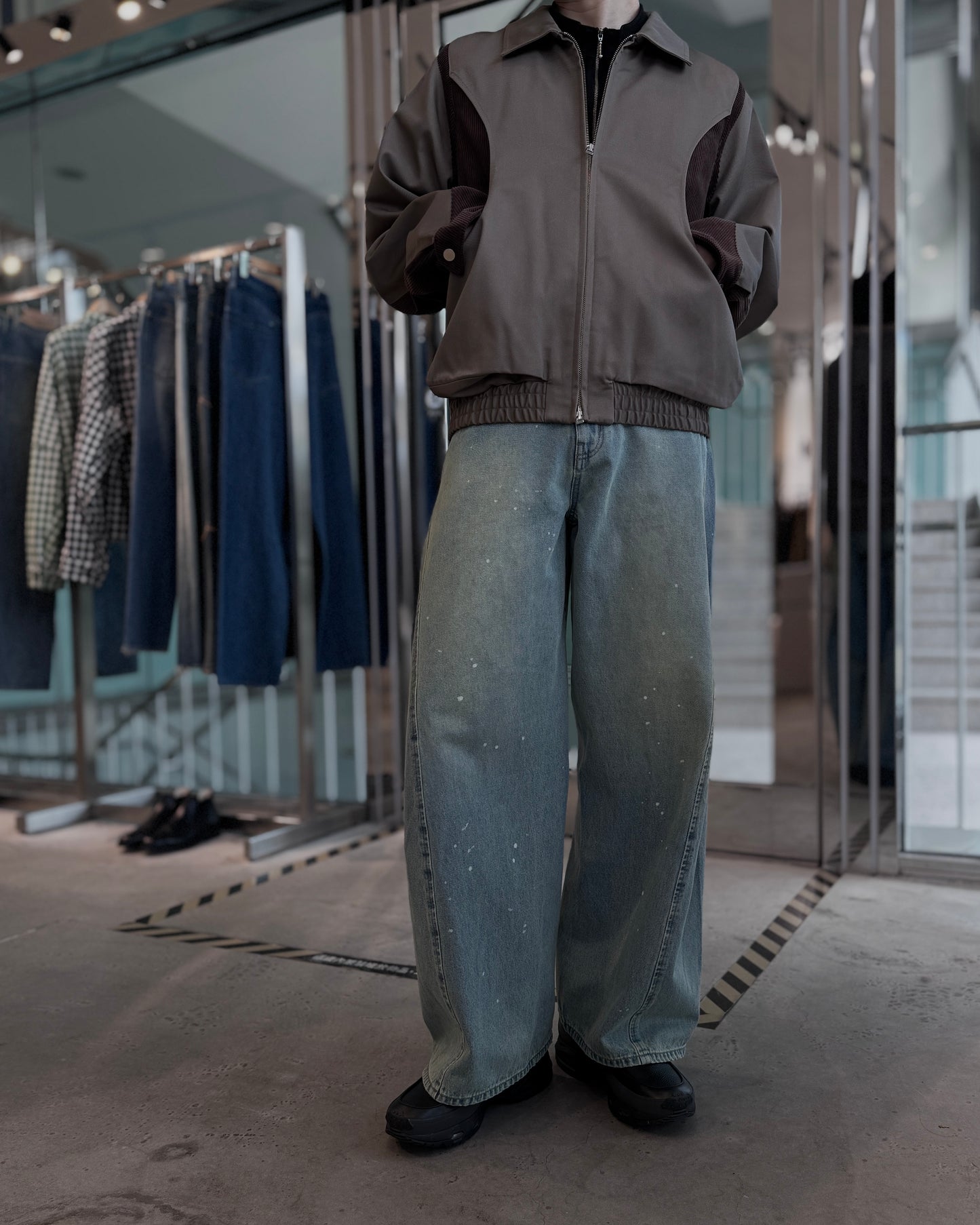 aging twisted denim pants