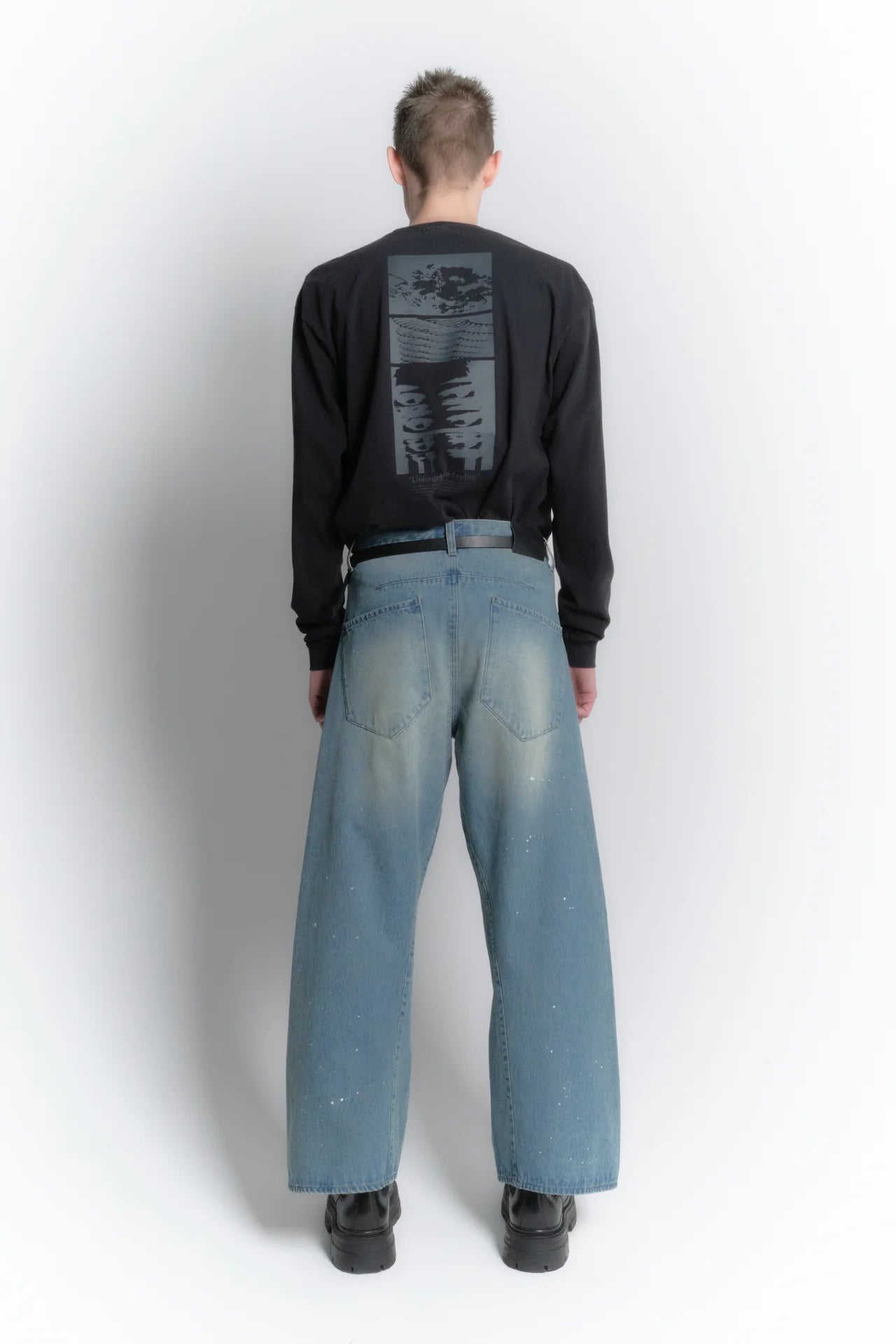aging twisted denim pants