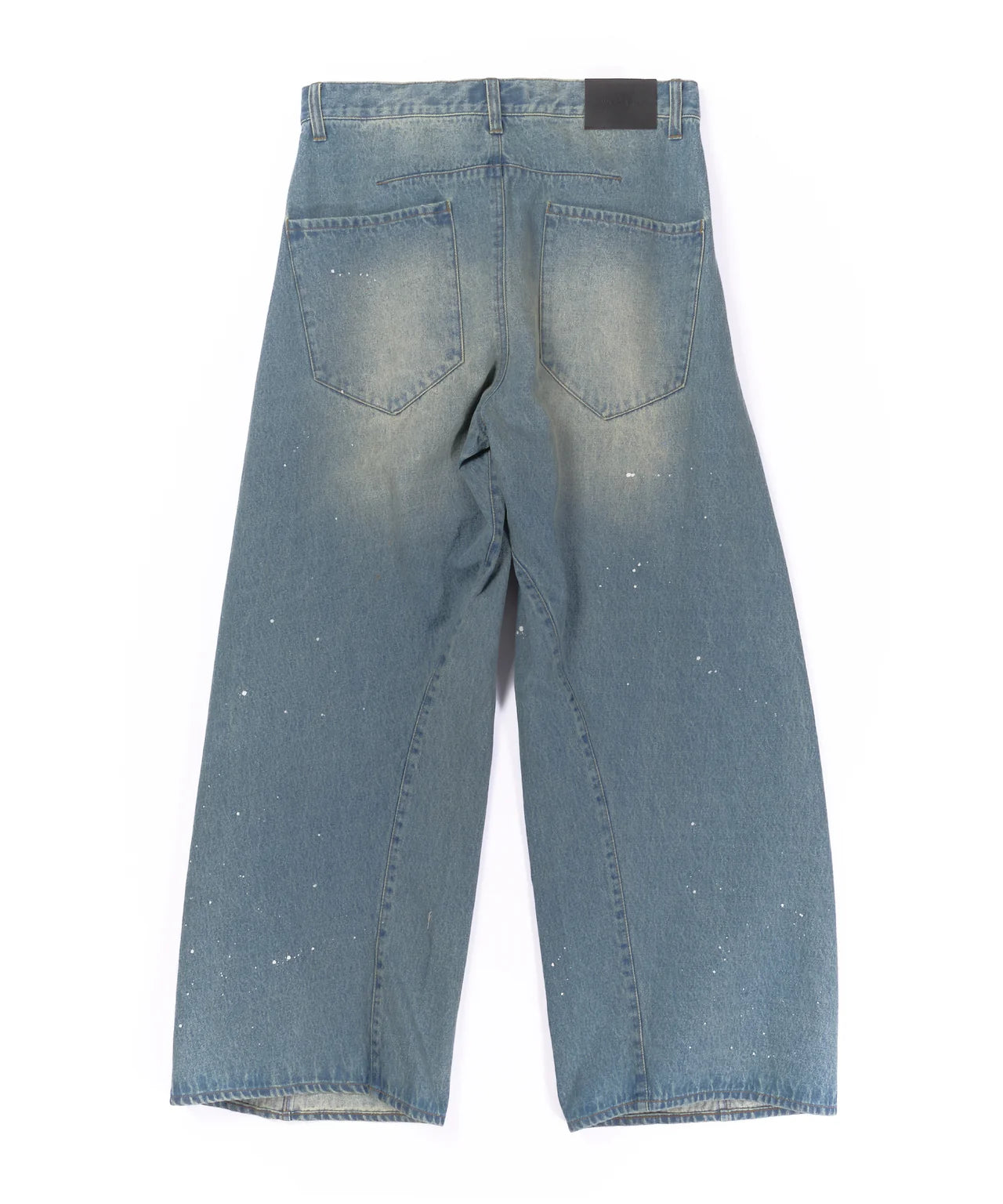 aging twisted denim pants