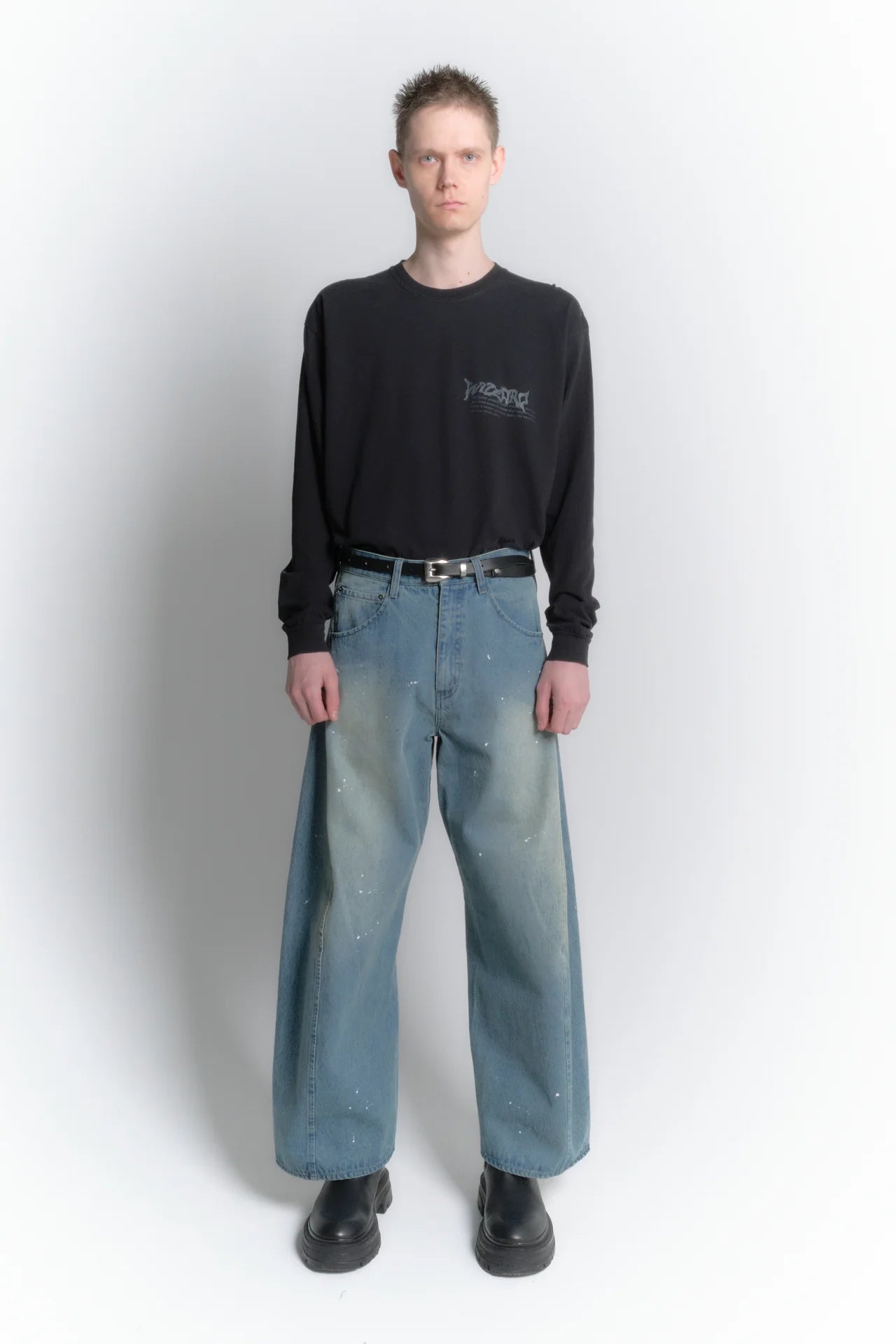 aging twisted denim pants