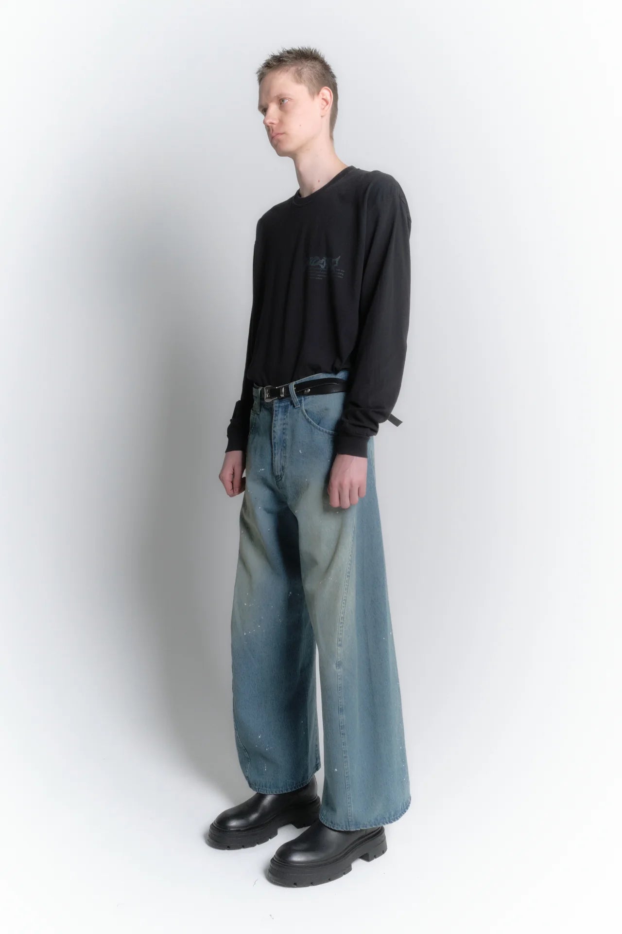 aging twisted denim pants