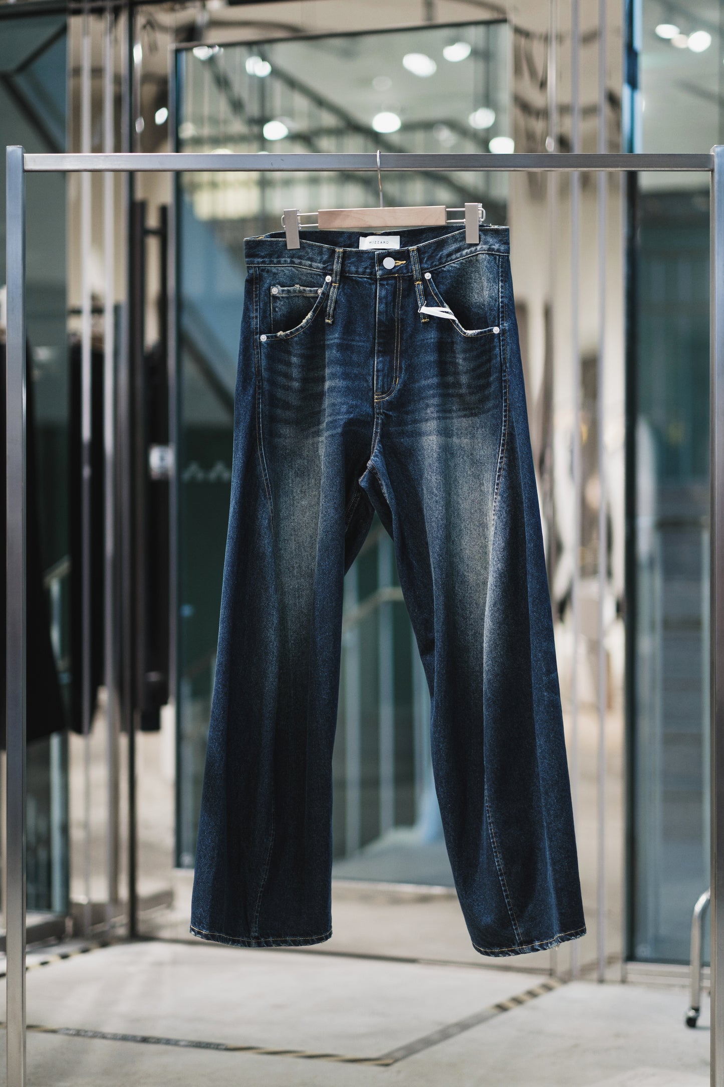 aging twisted denim pants