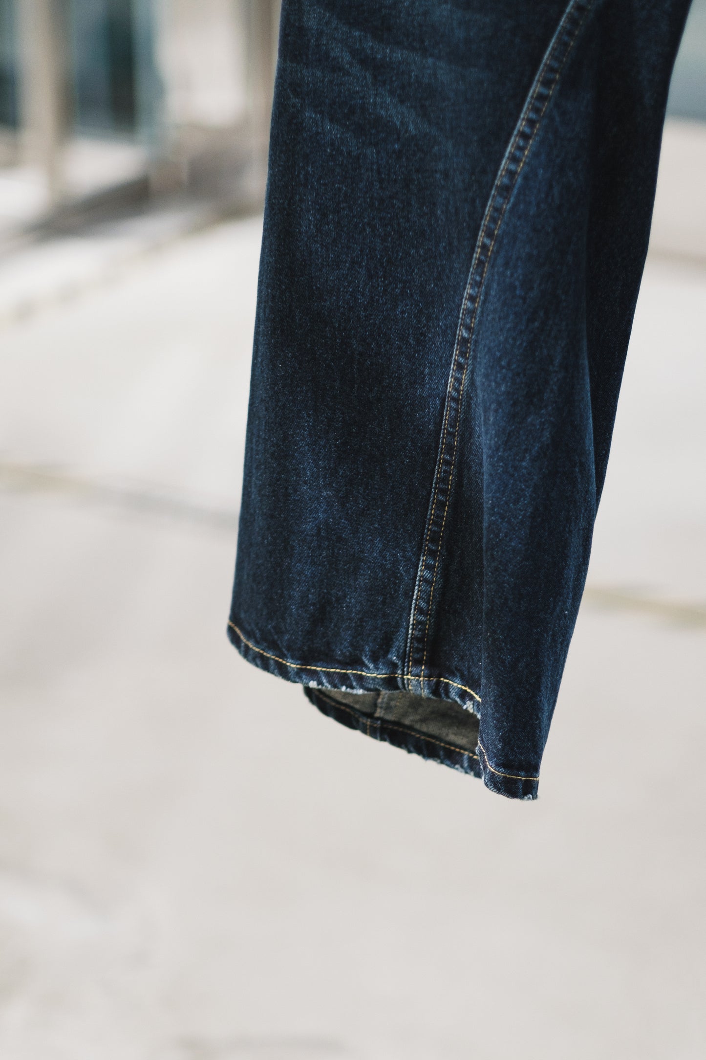 aging twisted denim pants