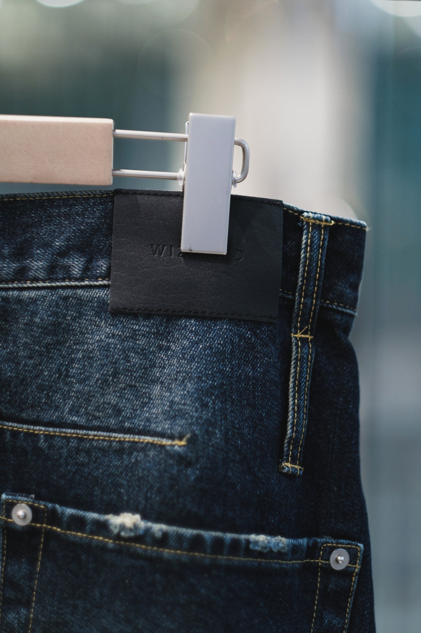 aging twisted denim pants