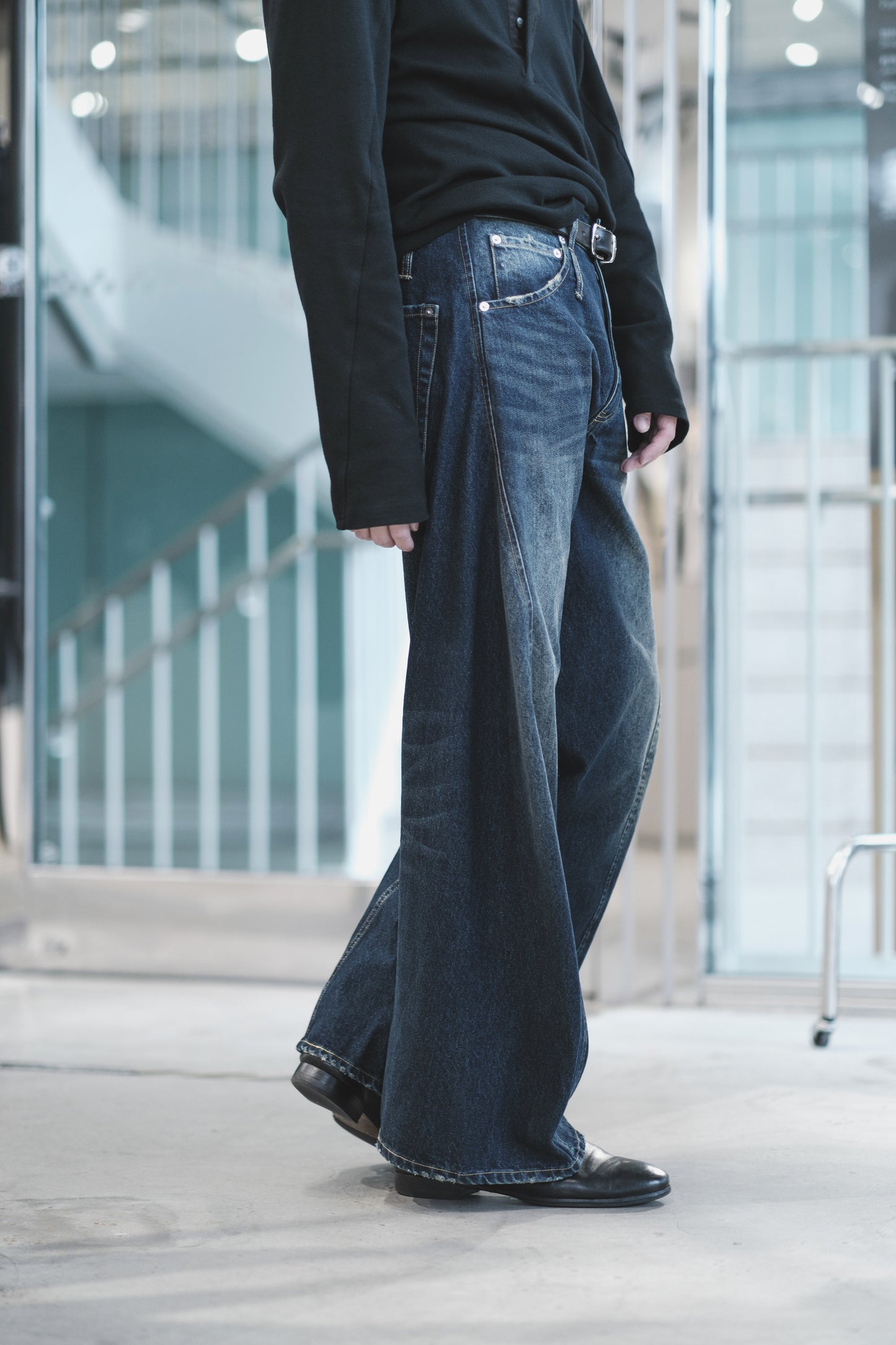 aging twisted denim pants