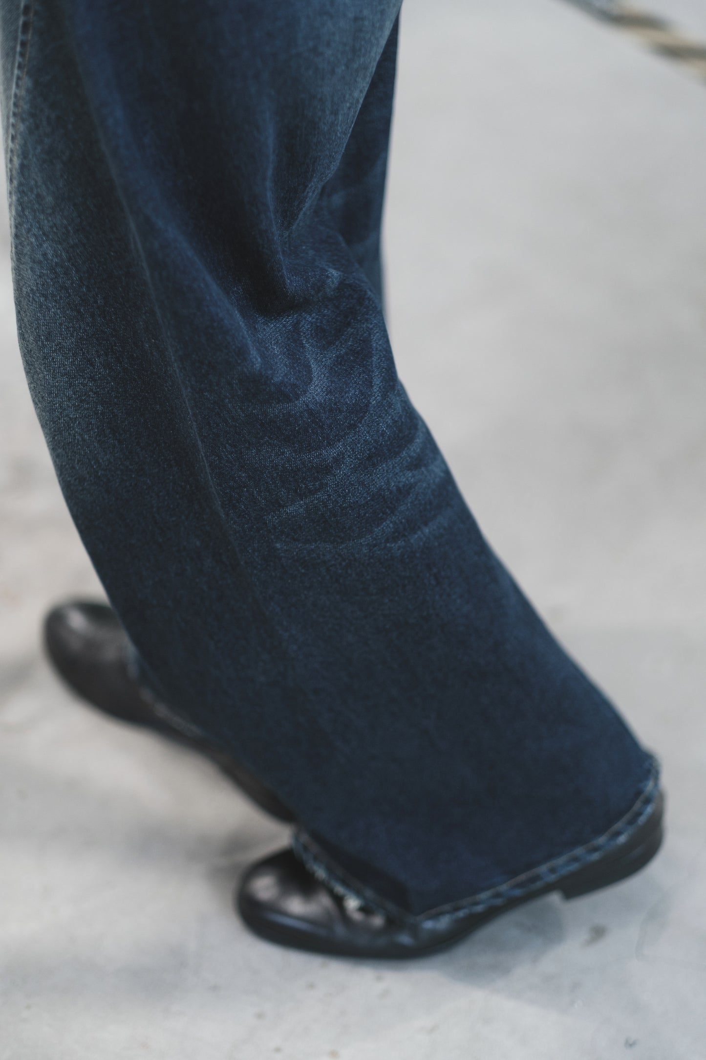 aging twisted denim pants