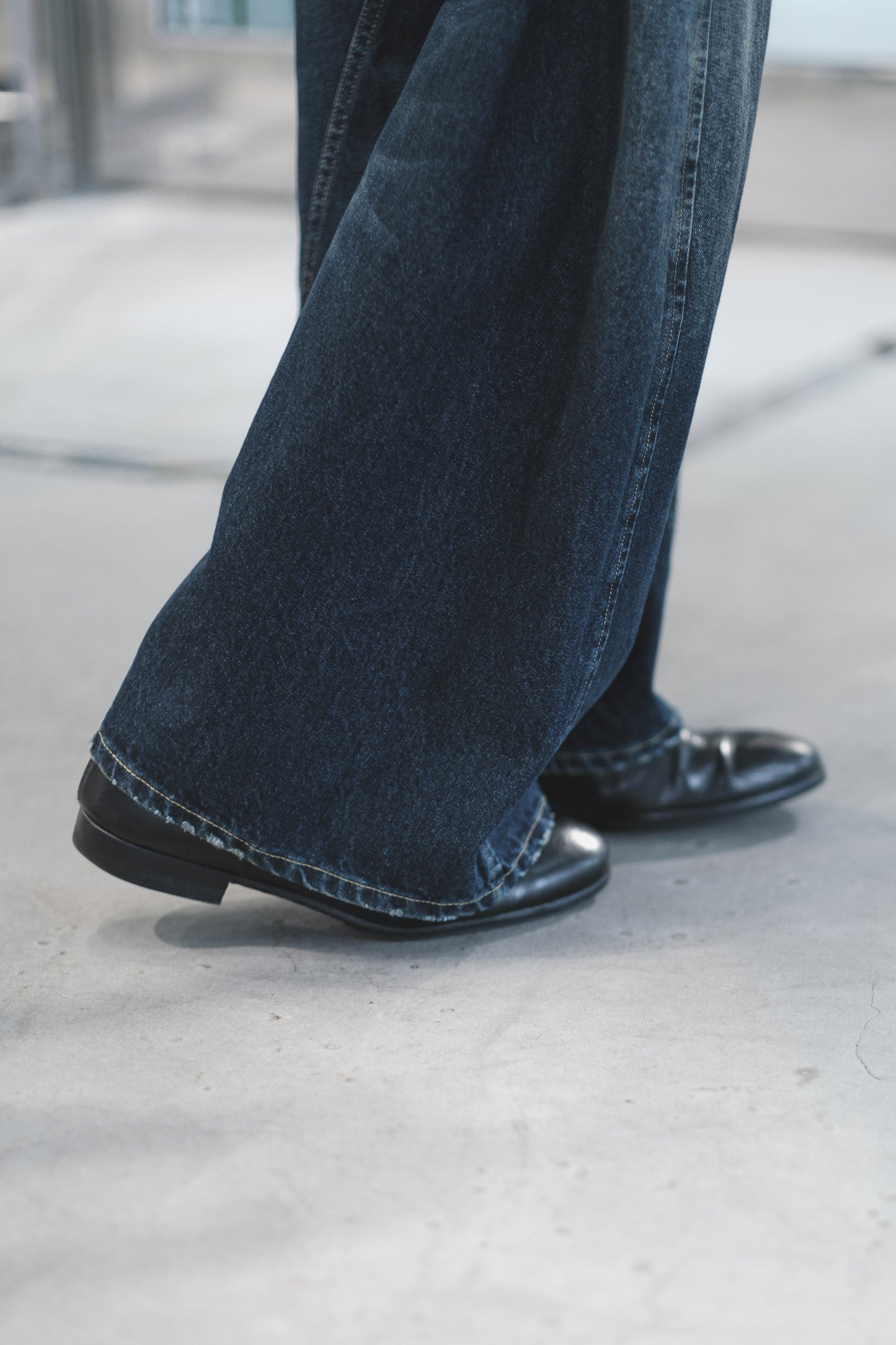 aging twisted denim pants