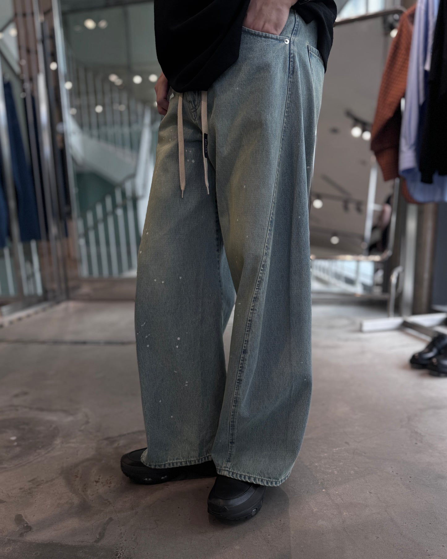 aging twisted denim pants