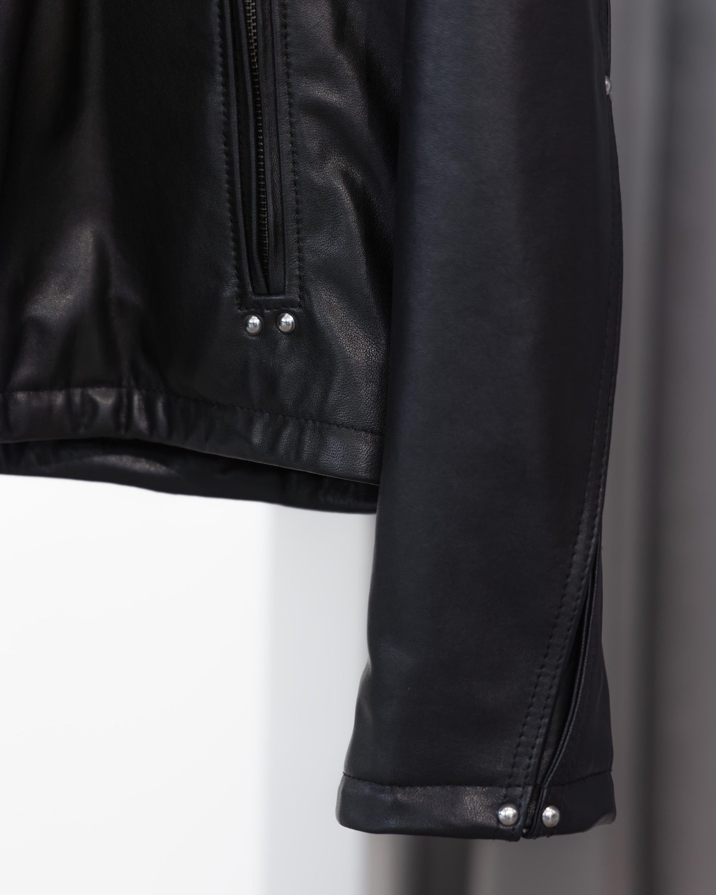 studded motion pleat leather jacket