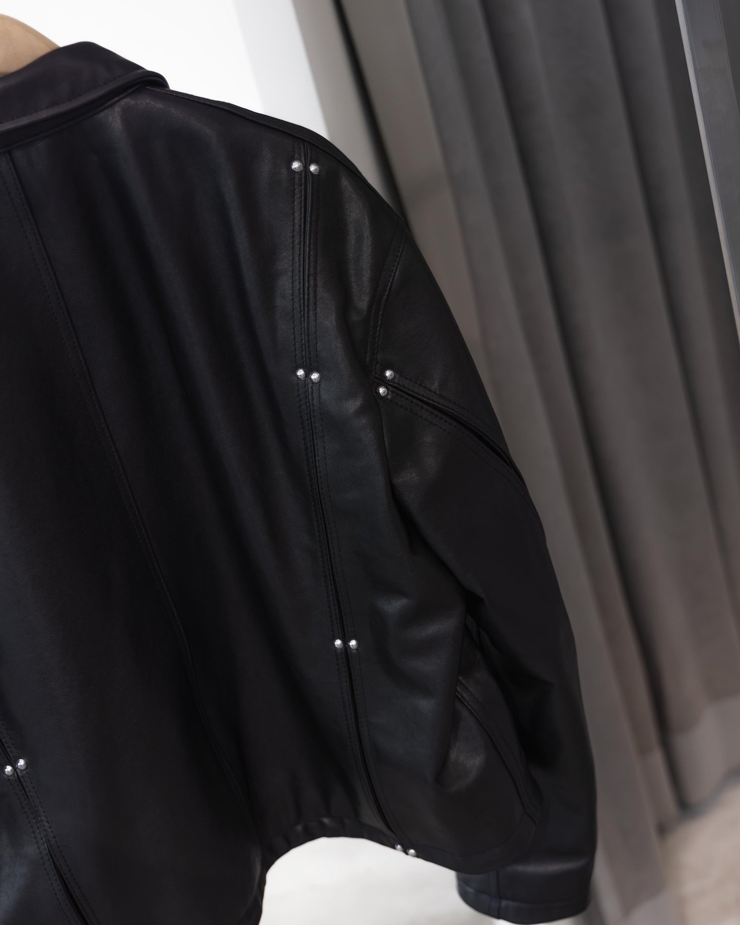 studded motion pleat leather jacket