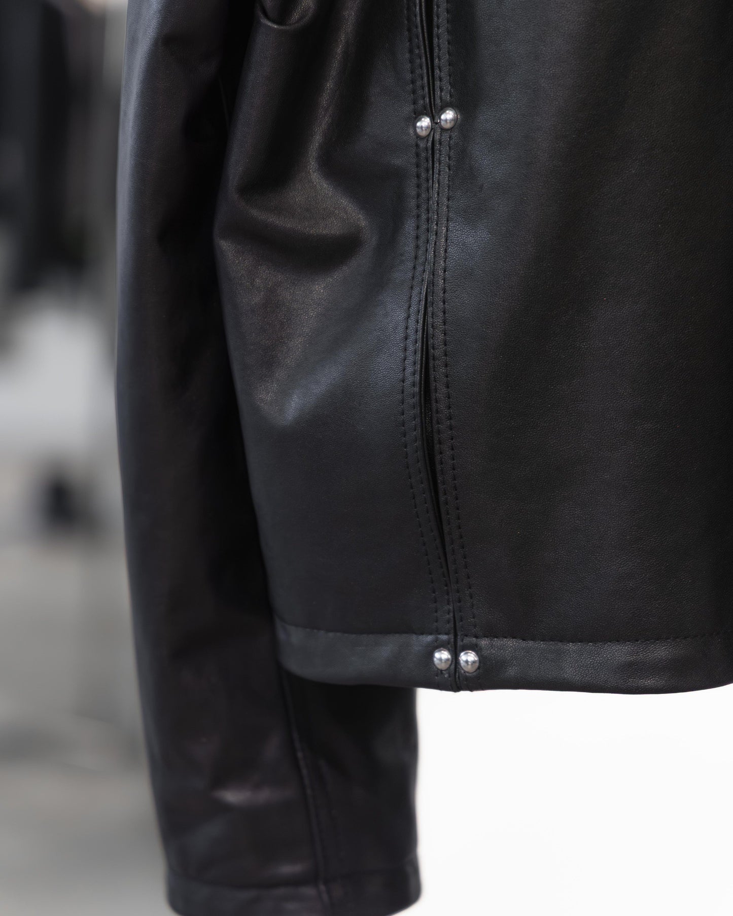 studded motion pleat leather jacket