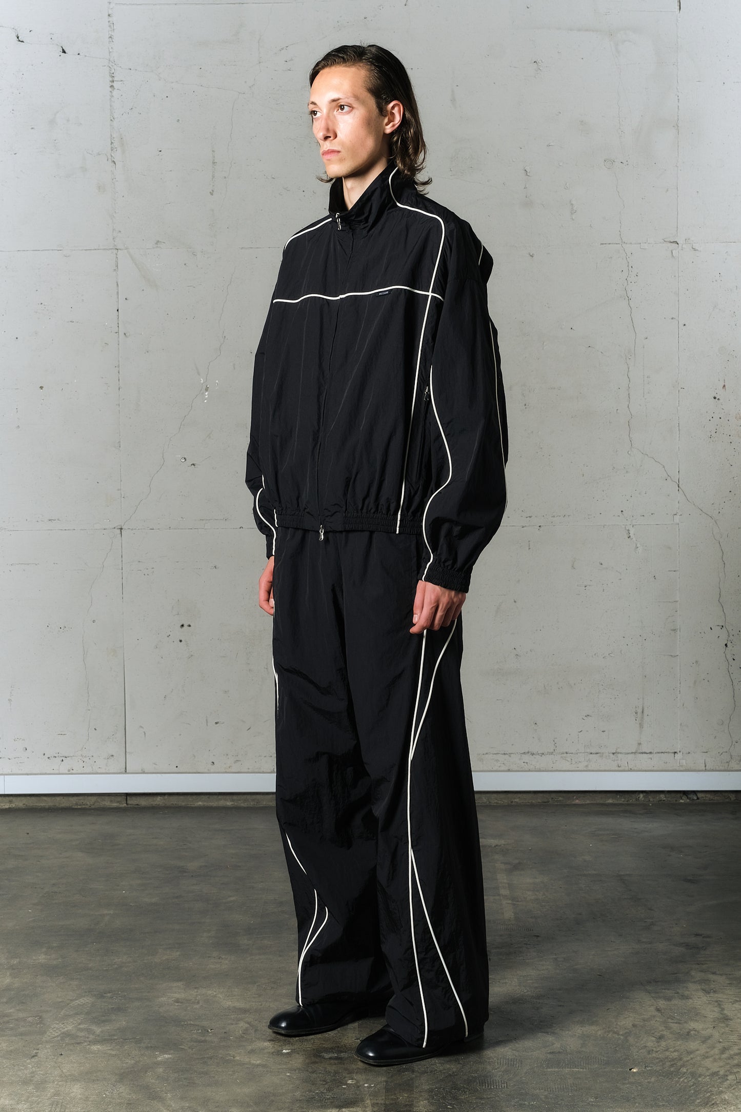 motion pleat ripstop track jacket